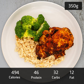 Portuguese Chicken with brown rice and vegetables served on a plate, A ready to eat pre packaged healthy meal