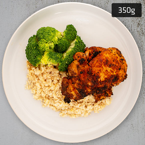 Portuguese Chicken with brown rice and vegetables served on a plate, A ready to eat pre packaged healthy meal